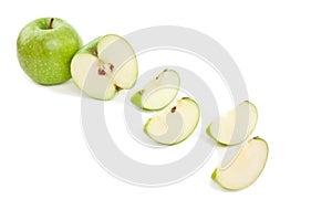 Picture of sliced green apple on white