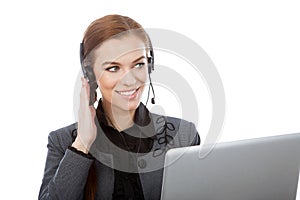 Picture of smiling female helpline operator with headphones. Iso