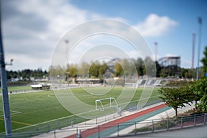 A picture of a soccer goal post taken with tilt-shift effect.