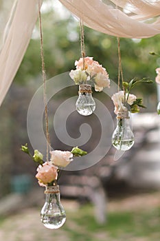 a picture of some glass vases that have flowers inside them