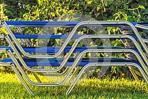 Picture of stacked sunbeds on the grass