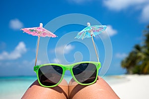 Picture of sunglasses on the tropical beach, vacation.