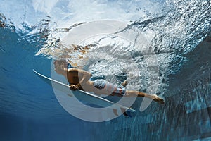 Picture of Surfing a Wave.Under Water Picture.