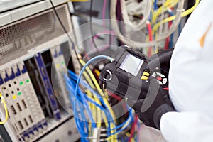 Picture of technician repairing cmts networking cards