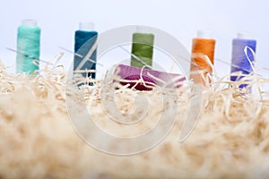 Picture of thread with needle on the rafi grass