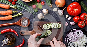 Picture on top of fresh vegetables, mushrooms, cutting board, oil, knife, hands of cook