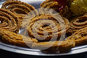 Picture of traditional festival snacks of India Chakali, Popular homemade salty and spicy snacks