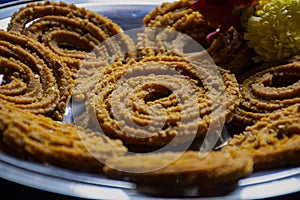 Picture of traditional festival snacks of India Chakali, Popular homemade salty and spicy snacks