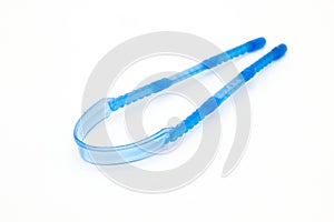 A picture of tungue cleaner isolated on white background