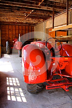 Two red tractors facing each other