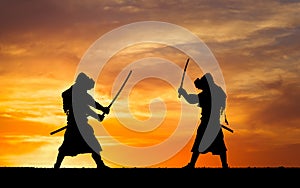 Picture with two samurais and sunset sky