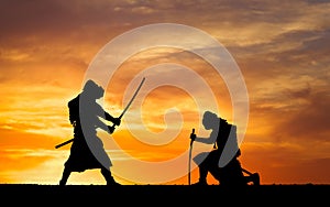 Picture with two samurais and sunset sky