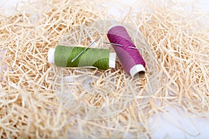 Picture of two thread with two needle on the rafi grass