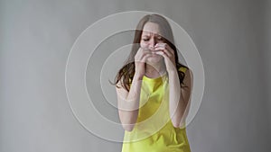 Picture of upset frustrated young lady woman writhing in pain, suffering from terrible headache, massaging temples