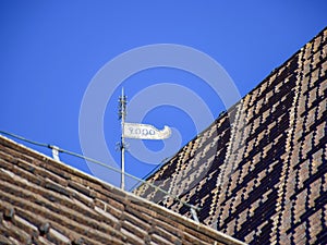 Picture of a very old stone house, fragments of wooden tile roof photo