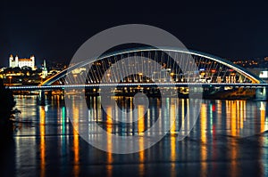 Night Danube in Bratislava, with Apollo bridge and Bratislava castle in the background