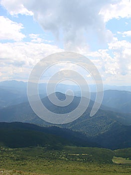 picture was taken from the mountain Goverla. The photo view of the clouds and the Carpathian Mountains