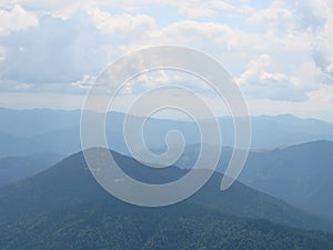 picture was taken from the mountain Goverla. The photo view of the clouds and the Carpathian Mountains