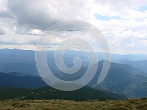 picture was taken from the mountain Goverla. The photo view of the clouds and the Carpathian Mountains