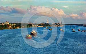 Lots of cargo ship transporting goods in the beautiful blue potenga sea in Chattogram, Bangladesh.