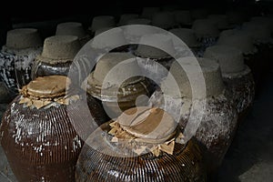A group of sealed ceramic beer barrel, stored in a beer factory in Zhou Zhuang, China. photo