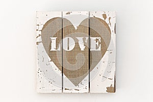 Picture of white wooden boards and painted brown heart photo
