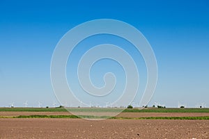 Picture of a windfarm in Serbia, in front of fields