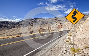 Picture of a winding road ahead sign