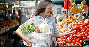 Picture of woman at marketplace buying fruits