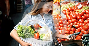 Picture of woman at marketplace buying fruits