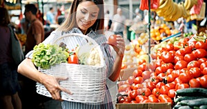 Picture of woman at marketplace buying fruits