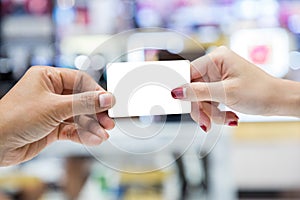 Picture of woman paying by credit card in restaurant