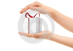 Picture of woman's hands holding a gift box photo