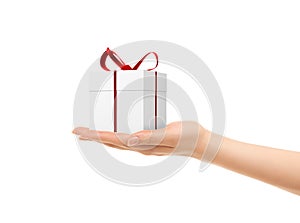 Picture of woman's hands holding a gift box photo