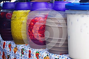 Picture of a woman serving Aguas frescas in a Honduras Market Tegucigalpa 2