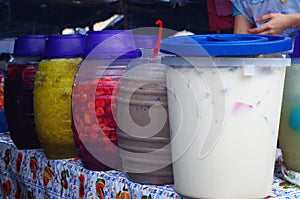 Picture of a woman serving Aguas frescas in a Honduras Market Tegucigalpa 2 photo