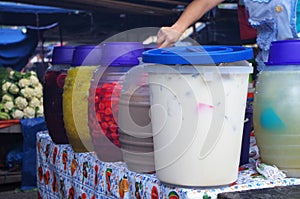 Picture of a woman serving Aguas frescas in a Honduras Market Tegucigalpa 2