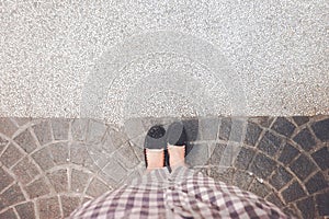 a picture of a woman wearing a pair of black shoes