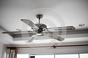 Picture of wooden ceiling fan inside the living room.