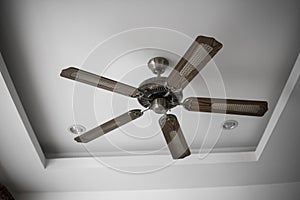 Picture of wooden ceiling fan inside the living room.