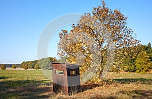 Picture of a wooden hunting hide in autumn