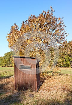 Picture of a wooden hunting hide in autumn