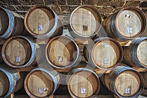 Picture of wooden wine barrels in the wine cellar