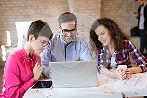 Picture of young architects discussing in office