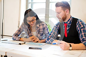 Picture of young architects discussing in office