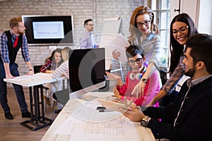 Picture of young architects discussing in office