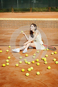 Picture of young beautiful brunette woman playing tennis on cour