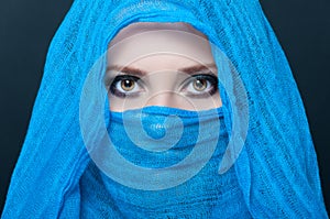 Picture of young female model in blue scarf