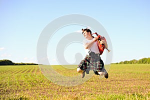 Picture of young man jumping high with pipes in