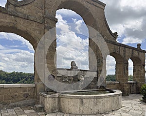 Ancient fountain of the seven spouts and arches in Pitigliano, Tuscany, Italy.